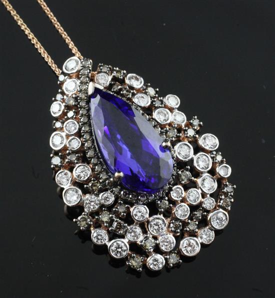 A 14ct gold, tanzanite and two colour diamond teardrop shaped pendant by Kallati, on a 14ct gold fine link chain, chain 18in.